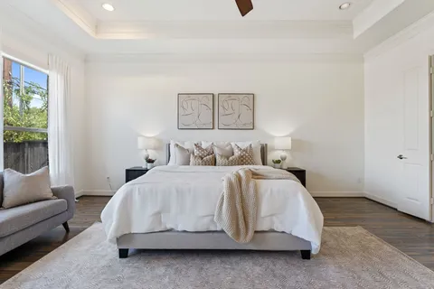 a bedroom with a bed and a couch