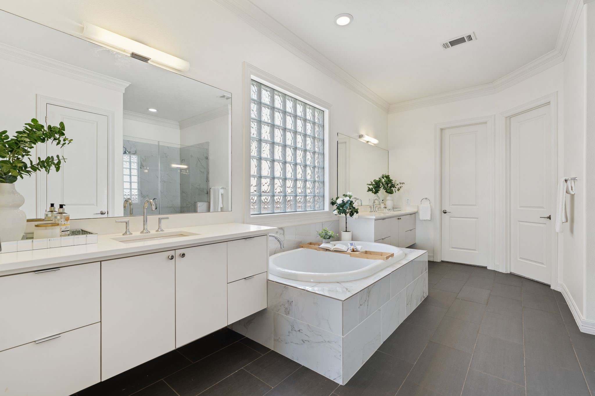 4822 Jason Street Houston, TX 77096 - Photo 27 of 45 a bathroom with a sink a mirror and a bathtub