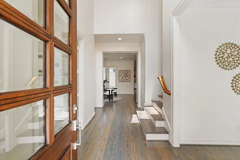 a view of an entryway with wooden floor