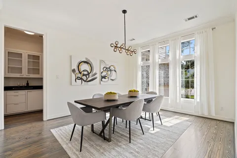 a view of a dining room with furniture window and wooden floor