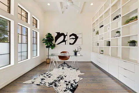a living room with a bathtub and a window