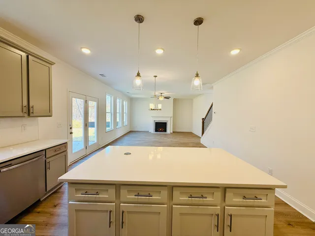 a kitchen with a stove a sink and a refrigerator