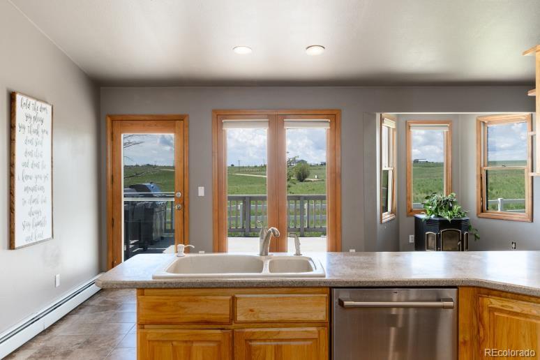 25876 County Road 5 Elbert, CO 80106 - Photo 13 of 43 a kitchen with kitchen island and large window