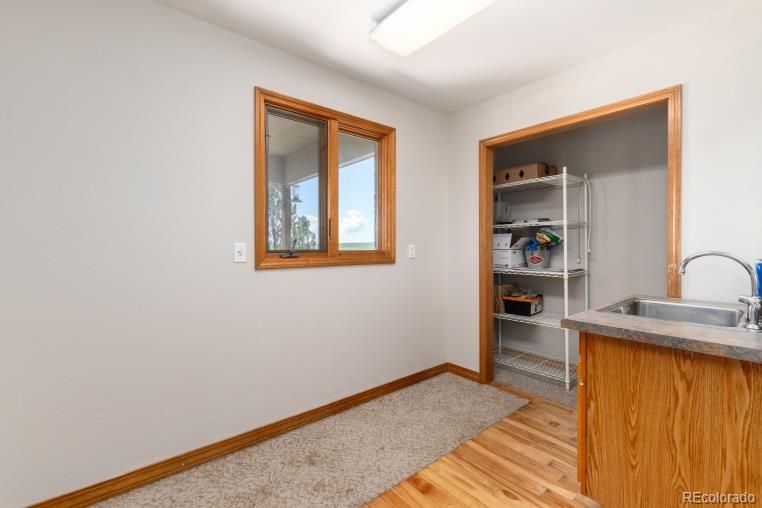 25876 County Road 5 Elbert, CO 80106 - Photo 16 of 43 a view of a bedroom with a bed and a window