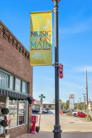 a street sign on a wall next to a building
