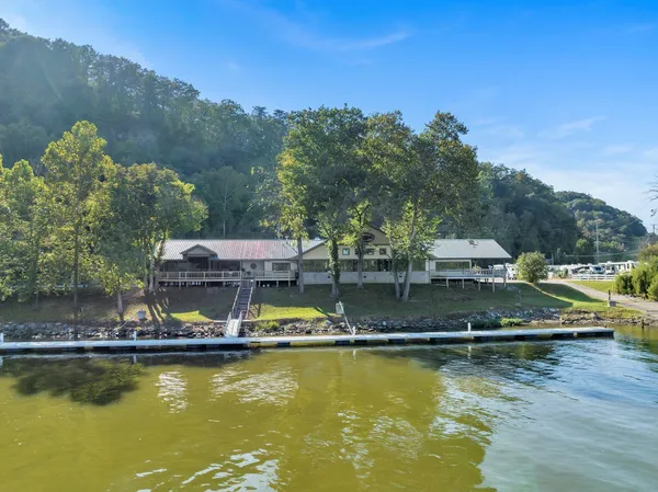 a view of a swimming pool with lounge chairs