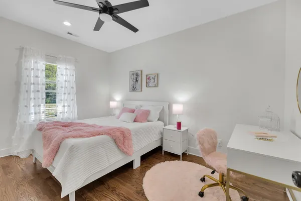 a bed room with a bed and a chandelier