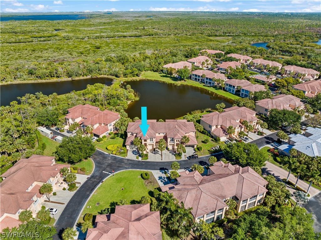 5080 Indigo Bay Boulevard, Unit 101 Estero, FL 33928 - Photo 5 of 33 an aerial view of ocean residential house with outdoor space