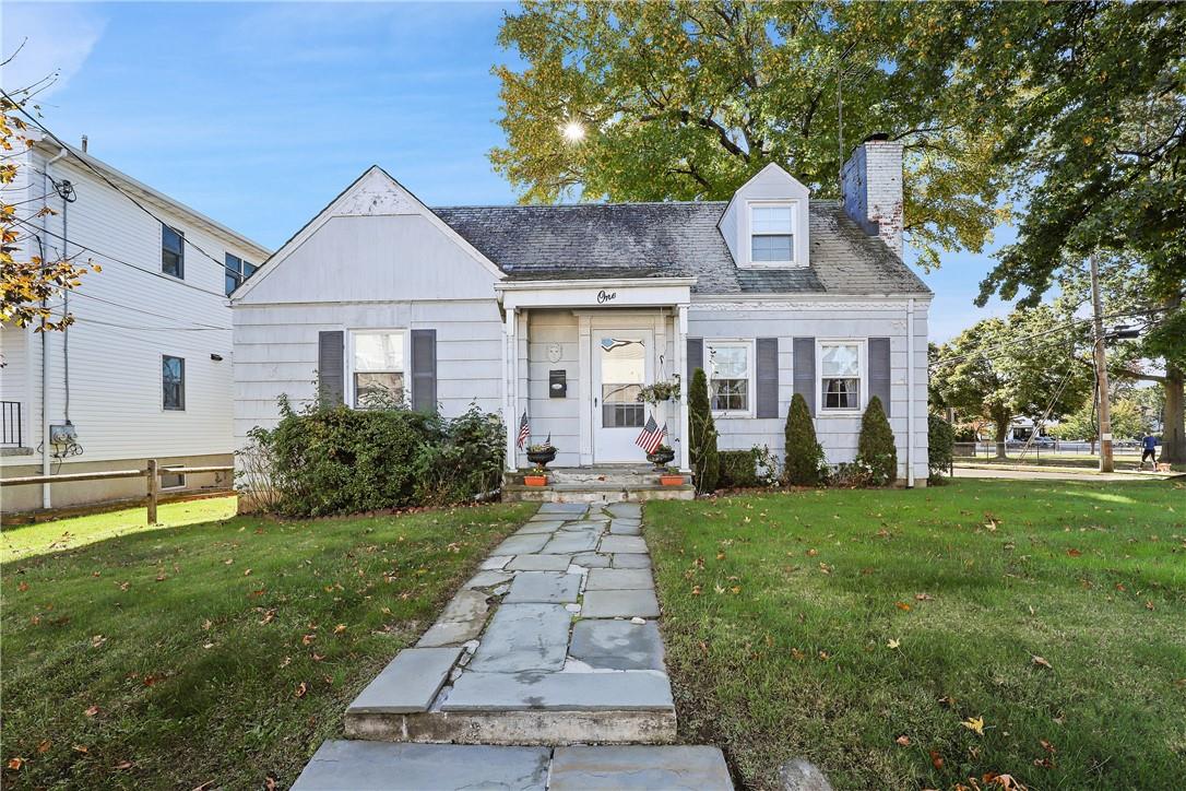 1 Maple Avenue Harrison, NY 10528 - Photo 1 of 1 a front view of a house with a yard