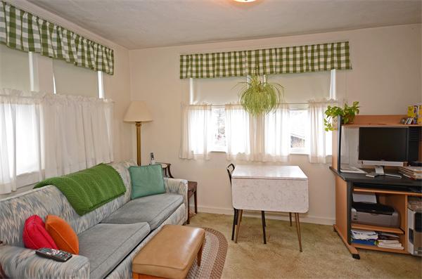 49 Katherine Road Watertown, MA 02472 - Photo 11 of 30 a living room with furniture and a flat screen tv