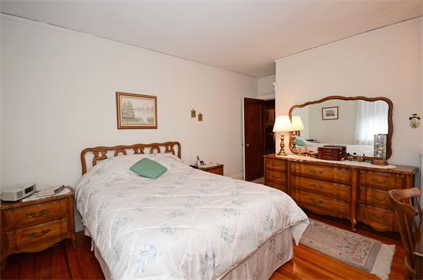 49 Katherine Road Watertown, MA 02472 - Photo 14 of 30 a bedroom with a bed and a dresser
