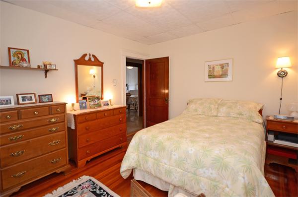 49 Katherine Road Watertown, MA 02472 - Photo 15 of 30 a large bed in a bedroom and dresser