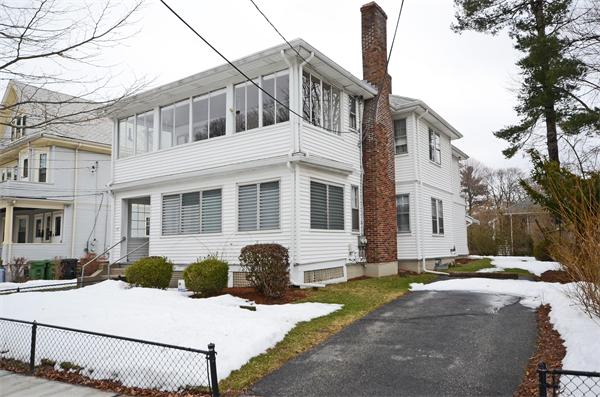 49 Katherine Road Watertown, MA 02472 - Photo 29 of 30 a view of a white house with a yard and windows
