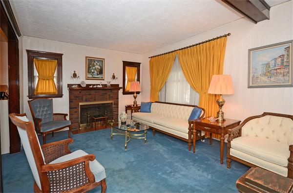 49 Katherine Road Watertown, MA 02472 - Photo 3 of 30 a living room with furniture and a fireplace