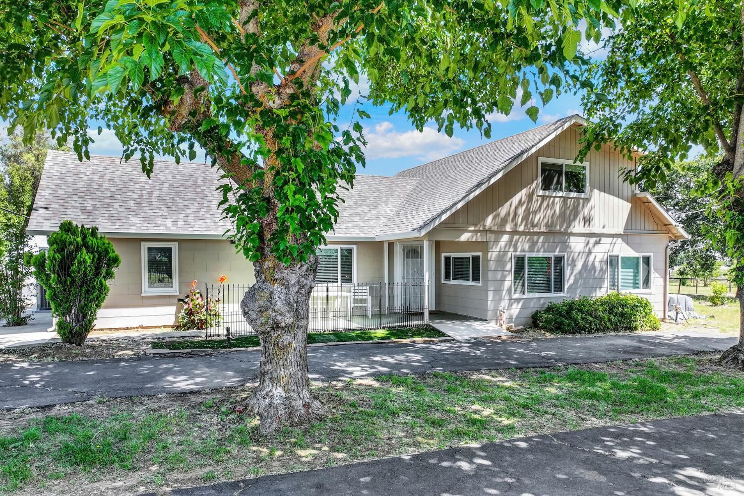 4851 Udell Road Vacaville, CA 95688 - Photo 5 of 65 a front view of a house with garden