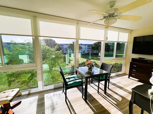 a view of a dining room with furniture window and outside view