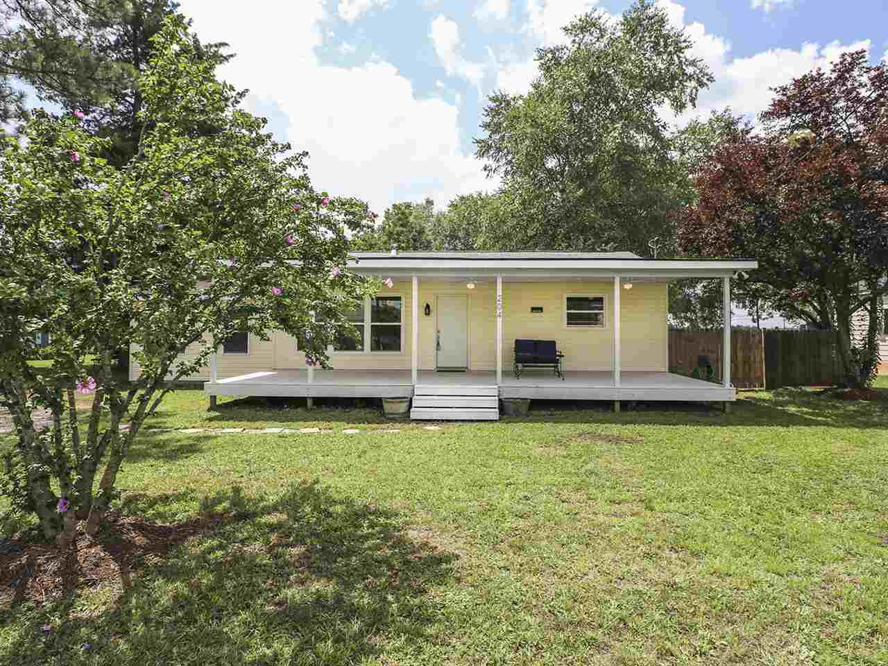 204 Proctor Street Zebulon, NC 27597 - Photo 1 of 30 a view of a house with backyard and porch