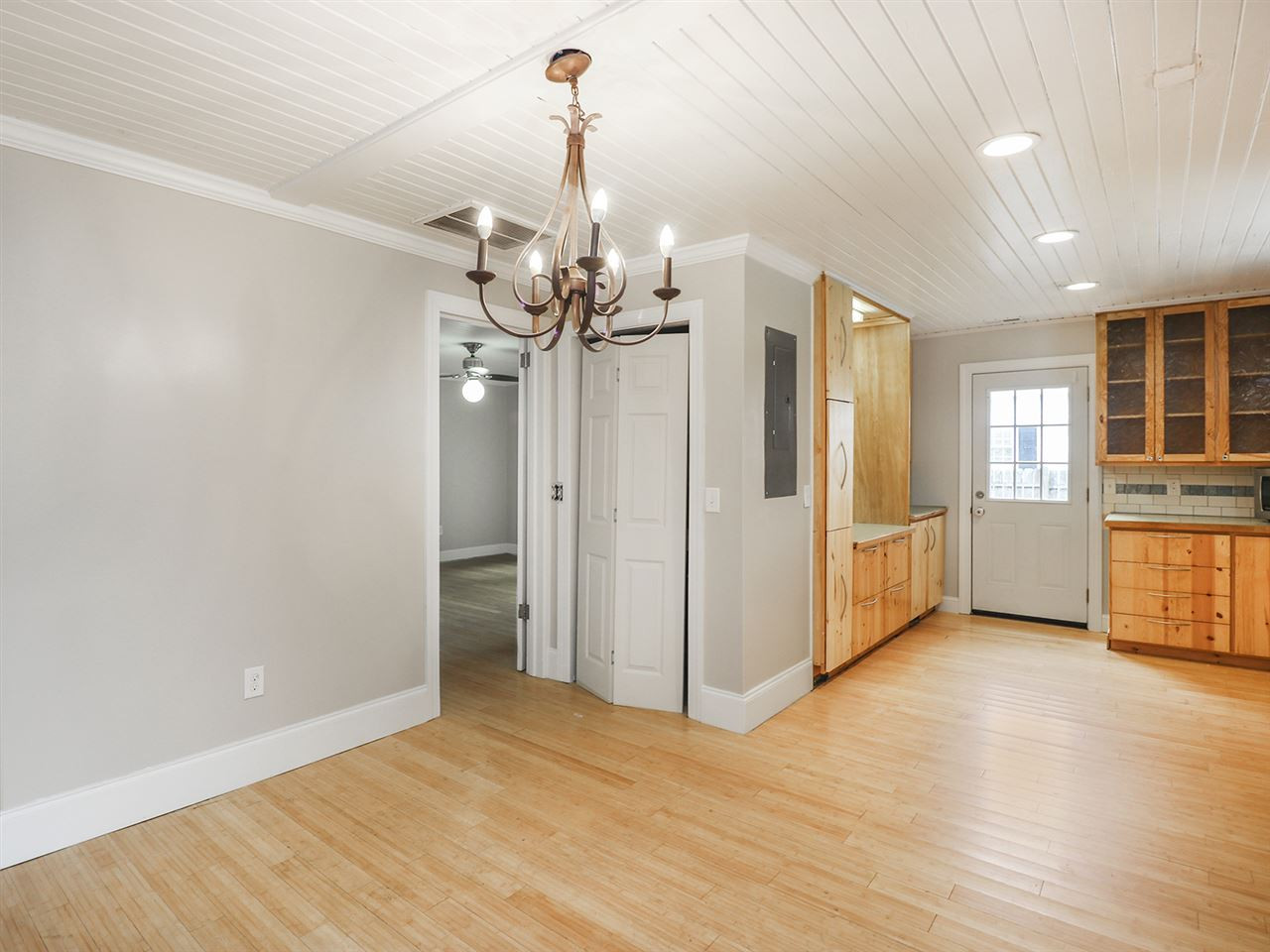 204 Proctor Street Zebulon, NC 27597 - Photo 12 of 30 a view of a livingroom with wooden floor and windows