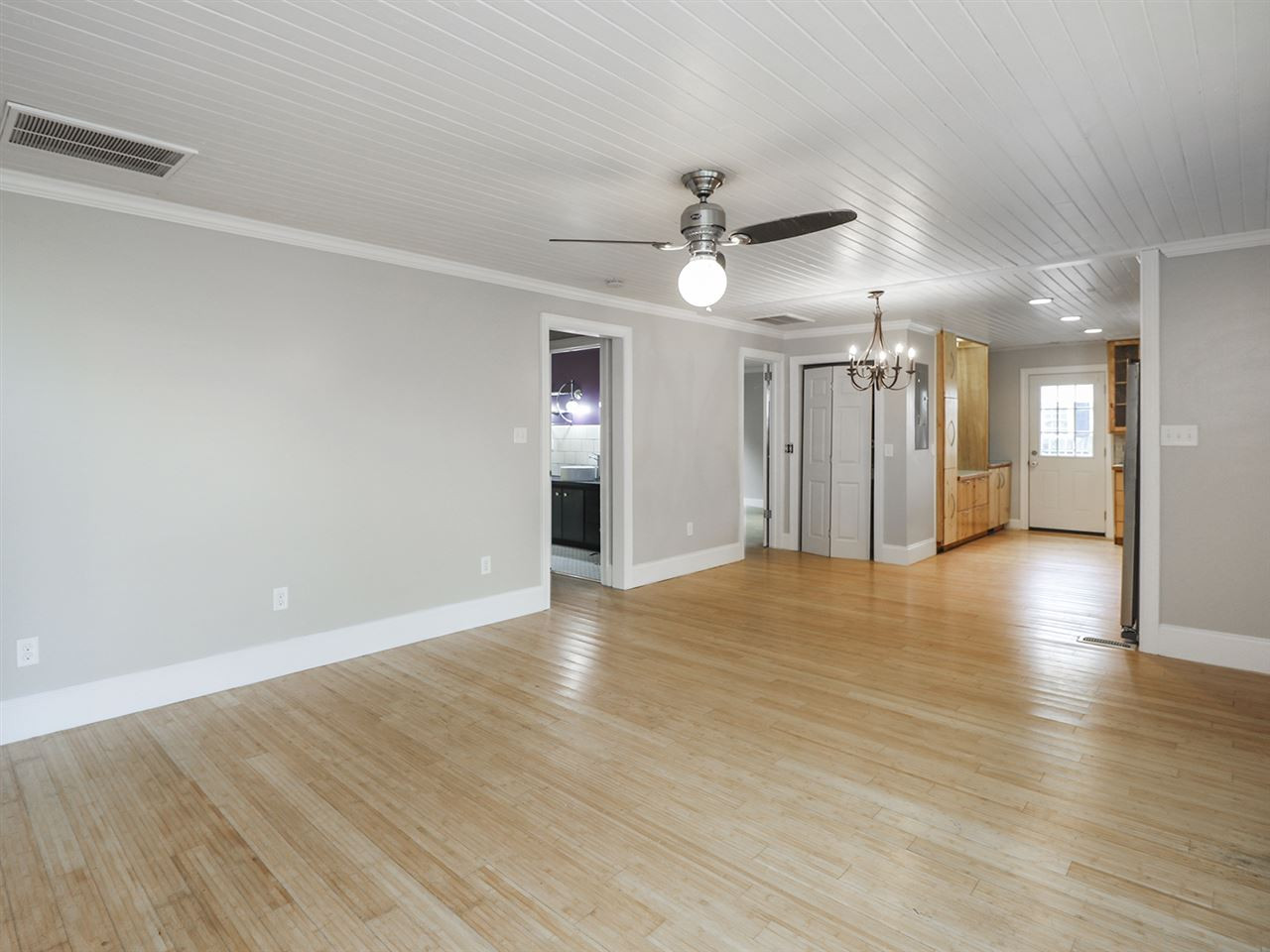 204 Proctor Street Zebulon, NC 27597 - Photo 19 of 30 wooden floor in an empty room with a window