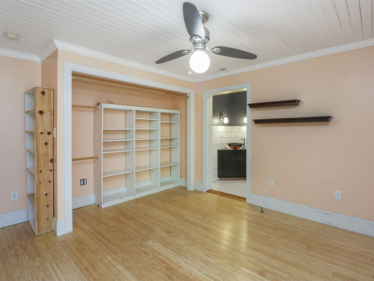 204 Proctor Street Zebulon, NC 27597 - Photo 23 of 30 wooden floor in an empty room with a window