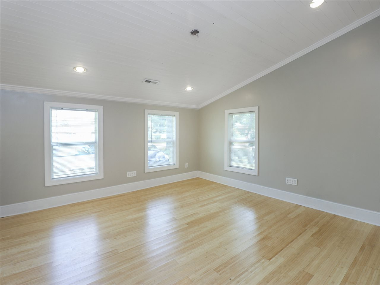 204 Proctor Street Zebulon, NC 27597 - Photo 26 of 30 a view of empty room with wooden floor and fan