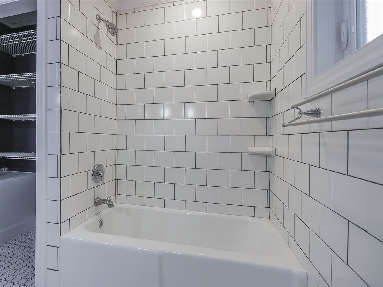 204 Proctor Street Zebulon, NC 27597 - Photo 27 of 30 a bathroom with a bathtub and shower