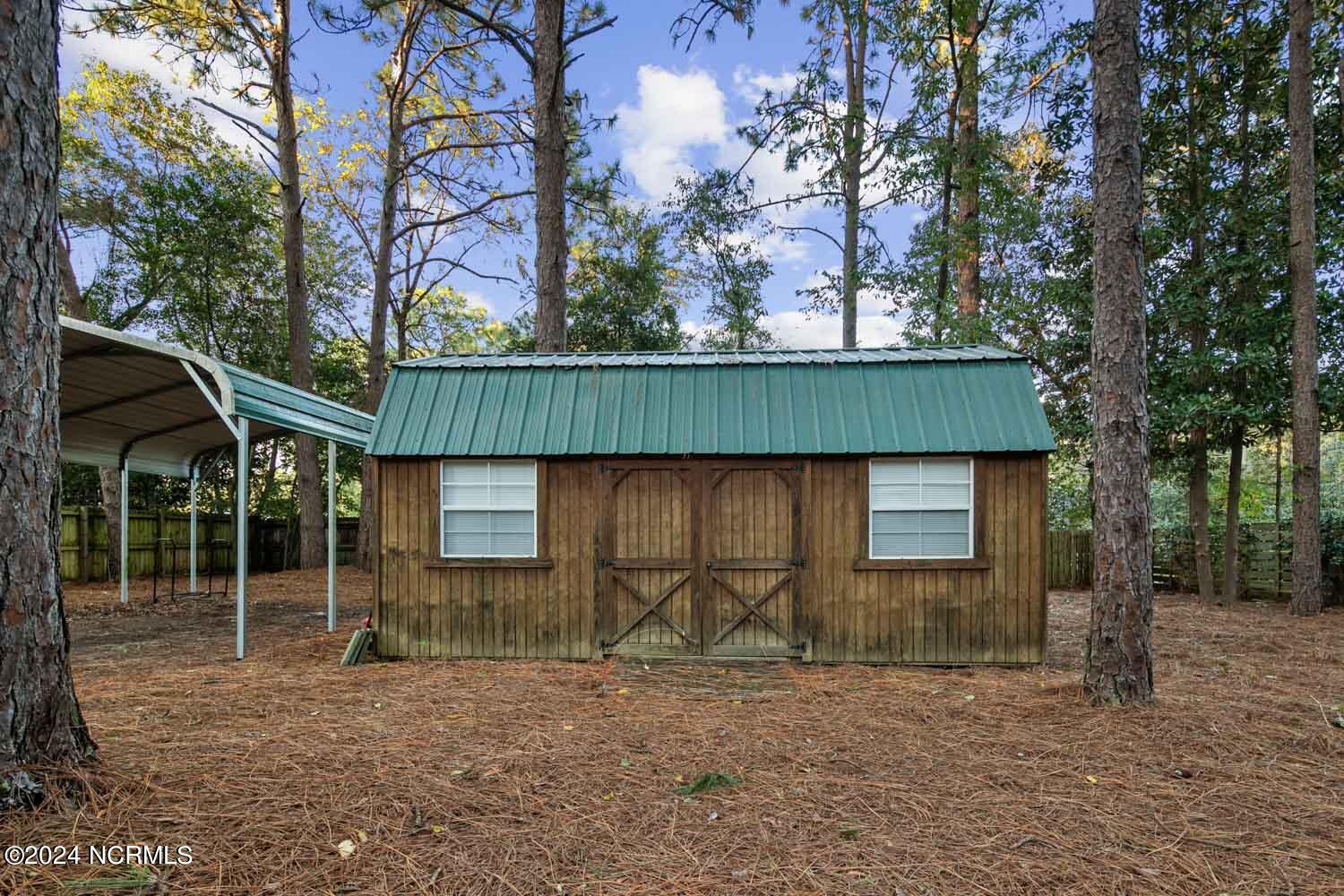 299 Braden Road Southern Pines, NC 28387 - Photo 13 of 19 Garden Shed in Backyard