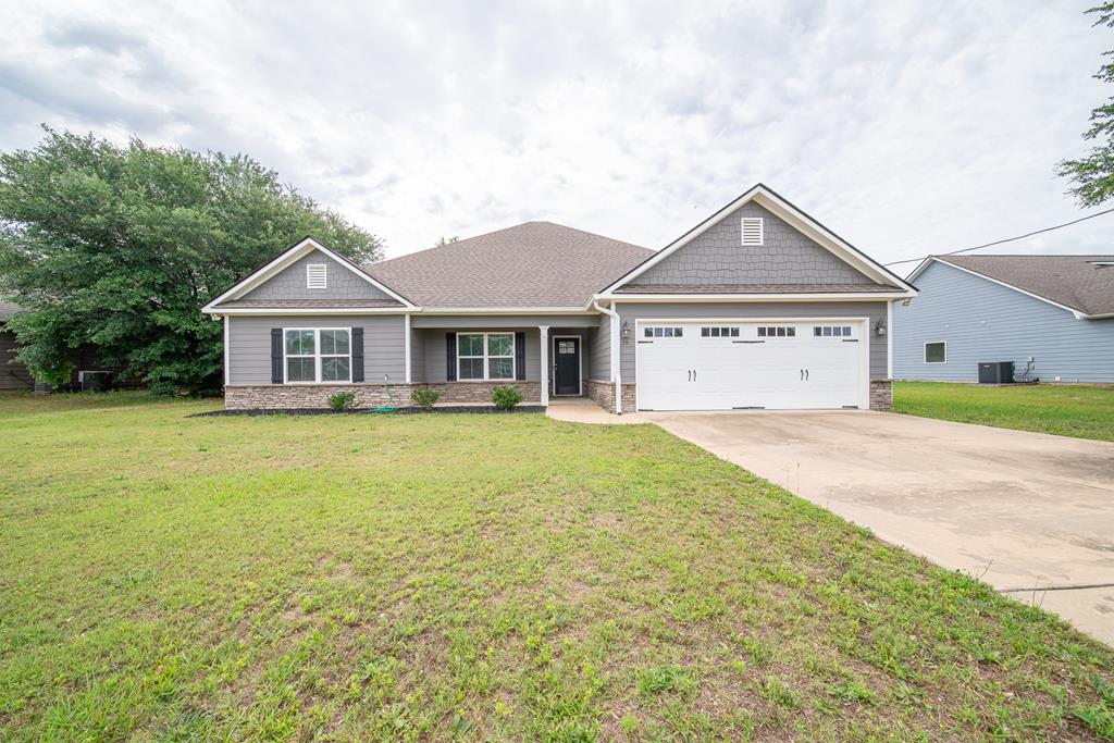 16 Maxwell Drive Fort Mitchell, AL 36856 - Photo 1 of 25 a view of a house with a garden and yard