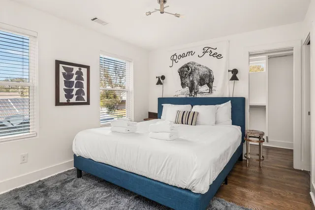 a bedroom with a bed and window