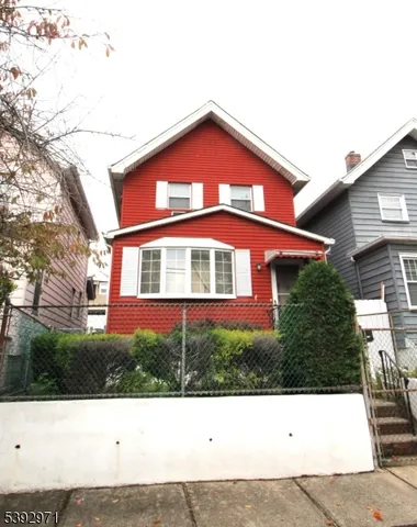 a black and white photo of a house