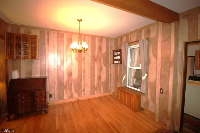 a view of a room with wooden floor and walls