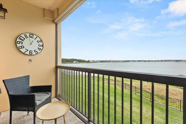 a view of a chair and table in a balcony