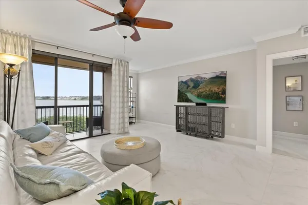 a living room with couches and a flat screen tv