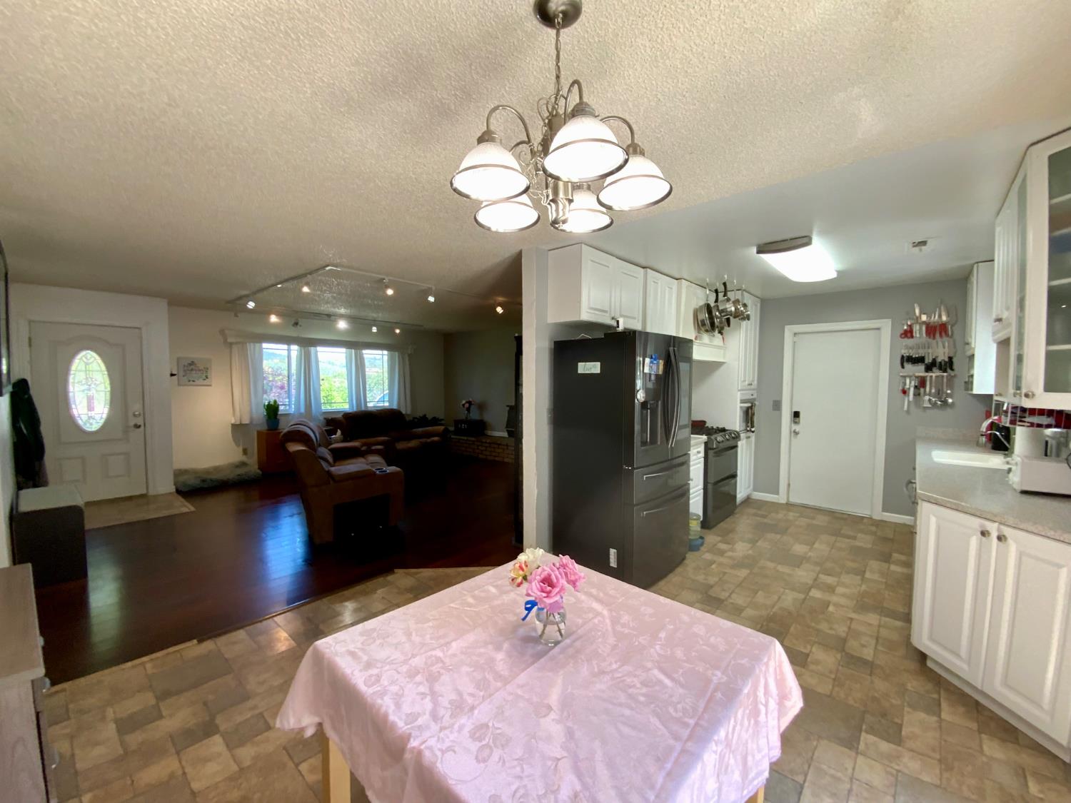 2367 Ponderosa Road Rescue, CA 95672 - Photo 2 of 76 a kitchen with a refrigerator and a chandelier