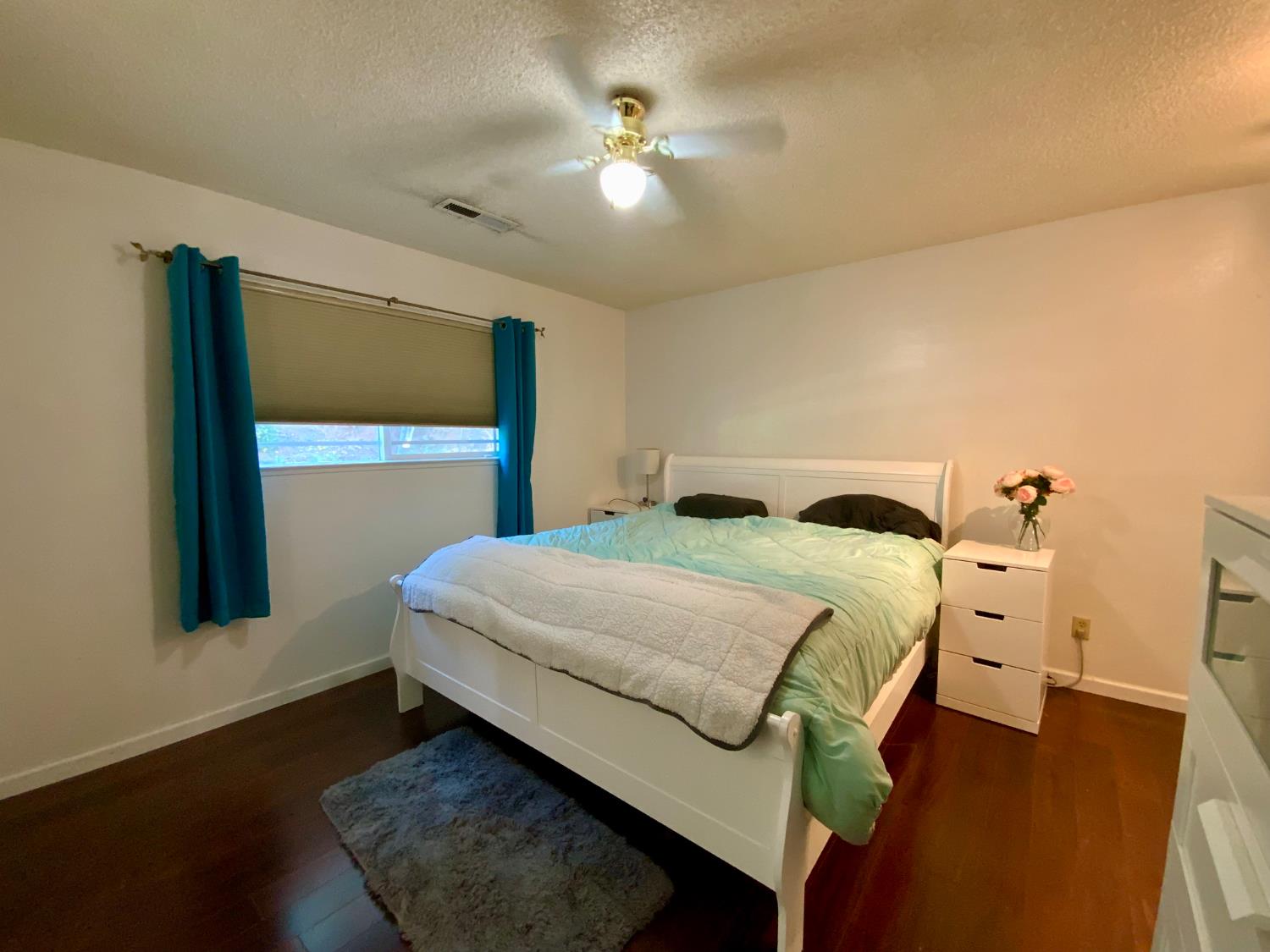 2367 Ponderosa Road Rescue, CA 95672 - Photo 21 of 76 a bedroom with a bed and a chandelier