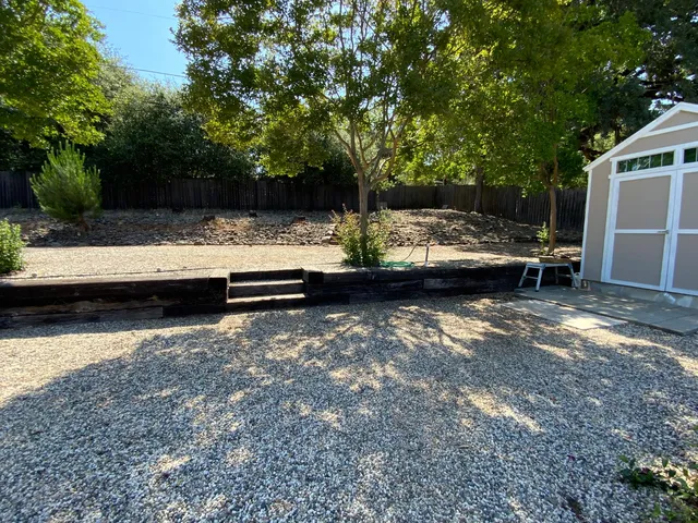 a view of a house with a yard porch and sitting area