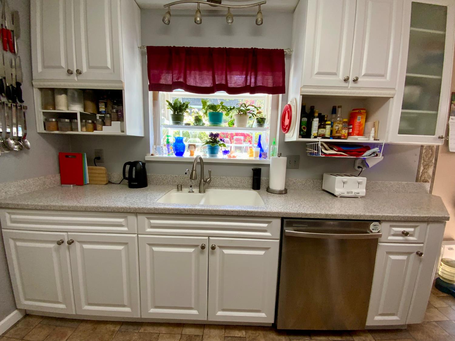 2367 Ponderosa Road Rescue, CA 95672 - Photo 7 of 76 a kitchen with stainless steel appliances granite countertop a stove a sink and white cabinets