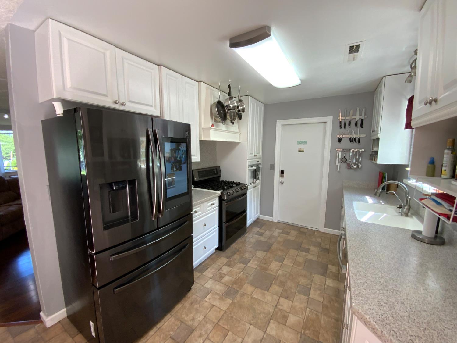2367 Ponderosa Road Rescue, CA 95672 - Photo 74 of 76 a kitchen with stainless steel appliances and refrigerator