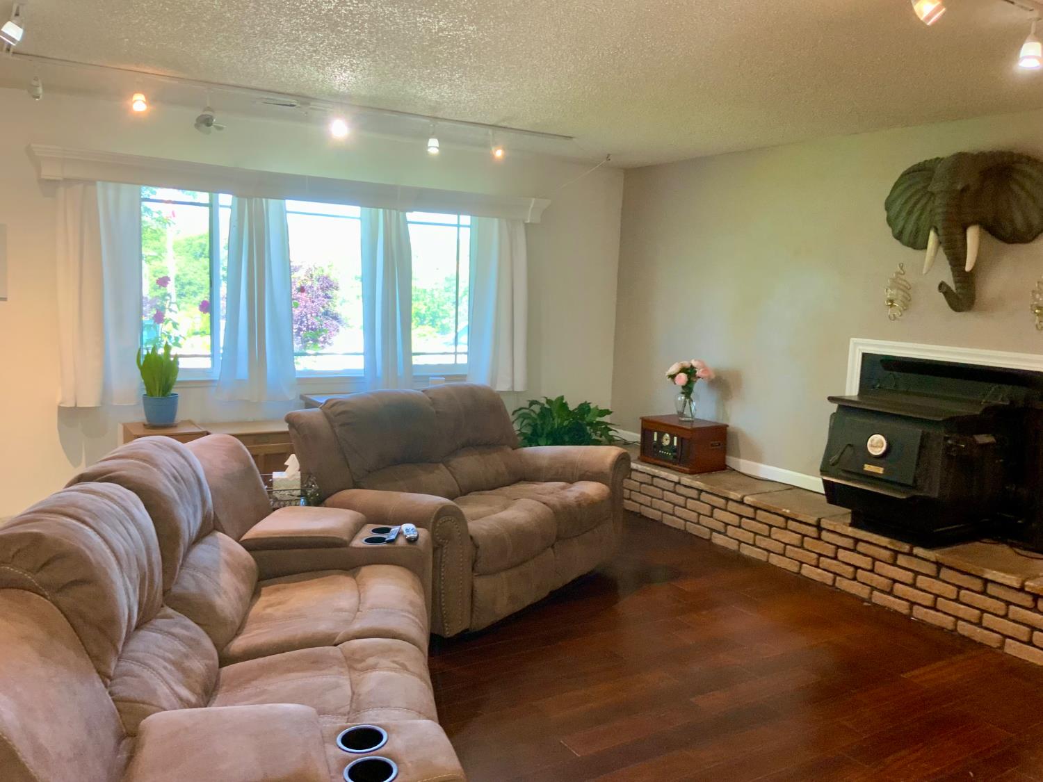2367 Ponderosa Road Rescue, CA 95672 - Photo 8 of 76 a living room with furniture and a fireplace