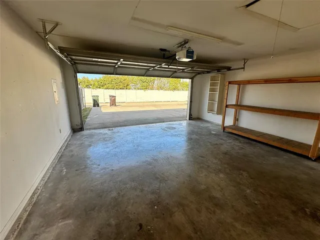 a view of a house with potted plants