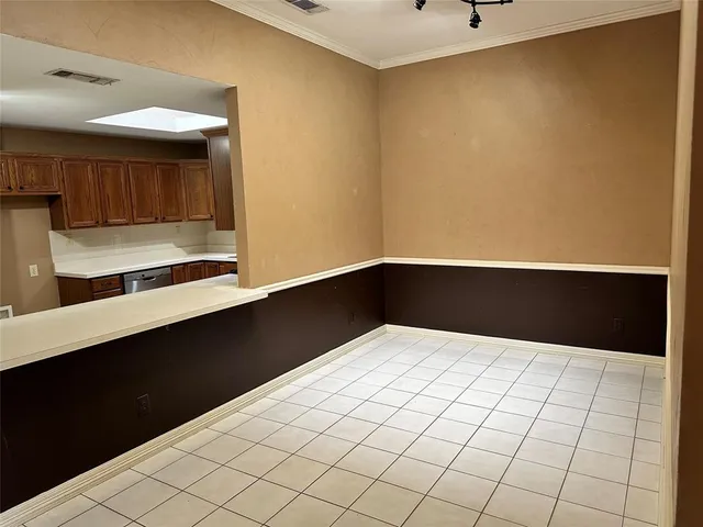 a view of a room with wooden floor and windows