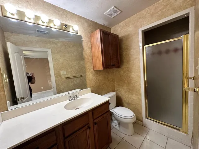 a kitchen with stainless steel appliances a sink a counter top space and cabinets