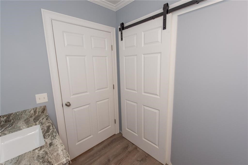 0 Bulgarmarsh Road, Unit 1 Tiverton, RI 02878 - Photo 12 of 19 a view of entryway with wooden floor