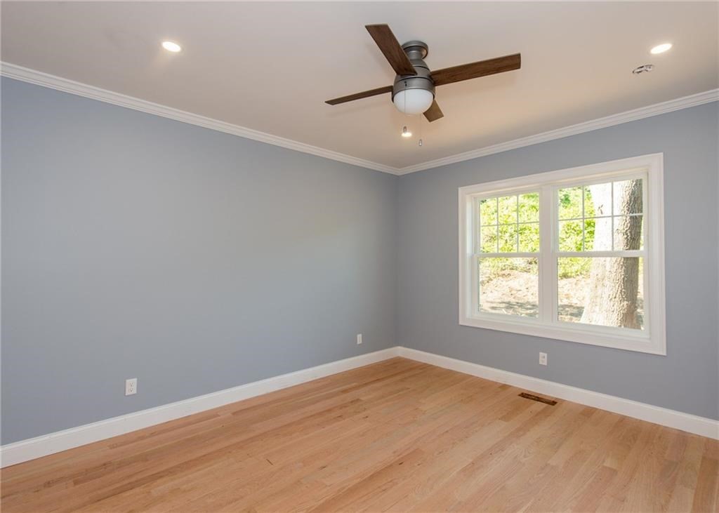 0 Bulgarmarsh Road, Unit 1 Tiverton, RI 02878 - Photo 3 of 19 wooden floor in an empty room with a window