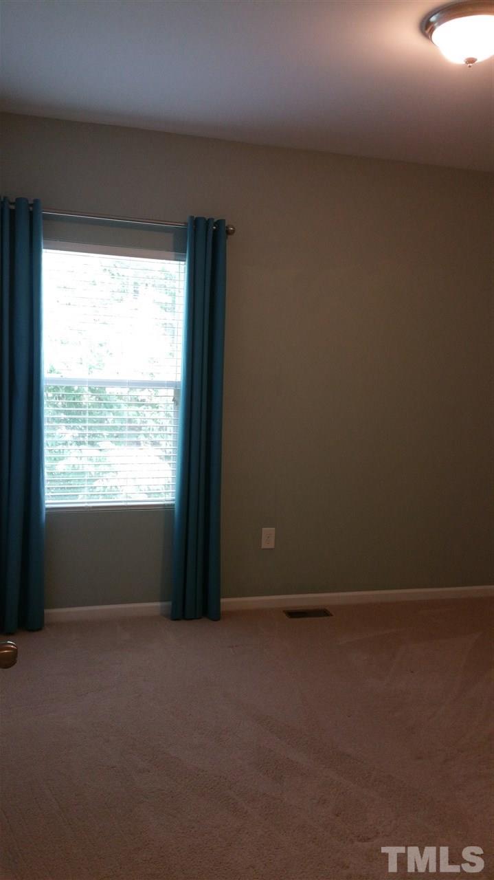 811 Davidson Point Road Cary, NC 27513 - Photo 22 of 24 a view of an empty room and a window