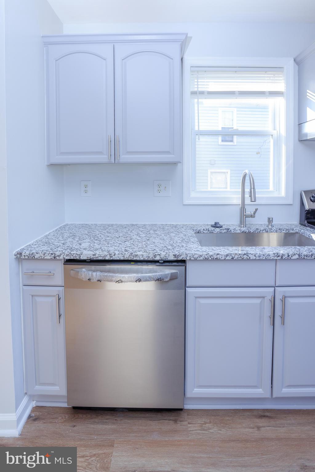 30 Queen Anne Road Glen Burnie, MD 21060 - Photo 12 of 47 a kitchen with granite countertop cabinets stainless steel appliances and a sink