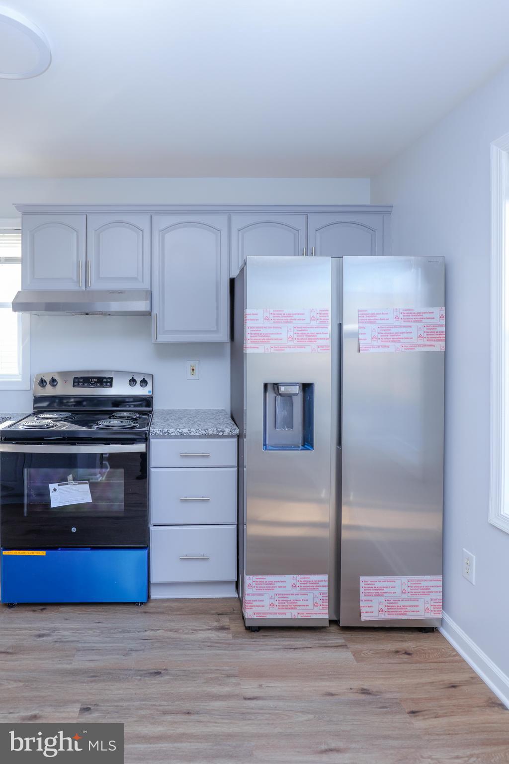 30 Queen Anne Road Glen Burnie, MD 21060 - Photo 14 of 47 a kitchen with granite countertop a refrigerator and a stove