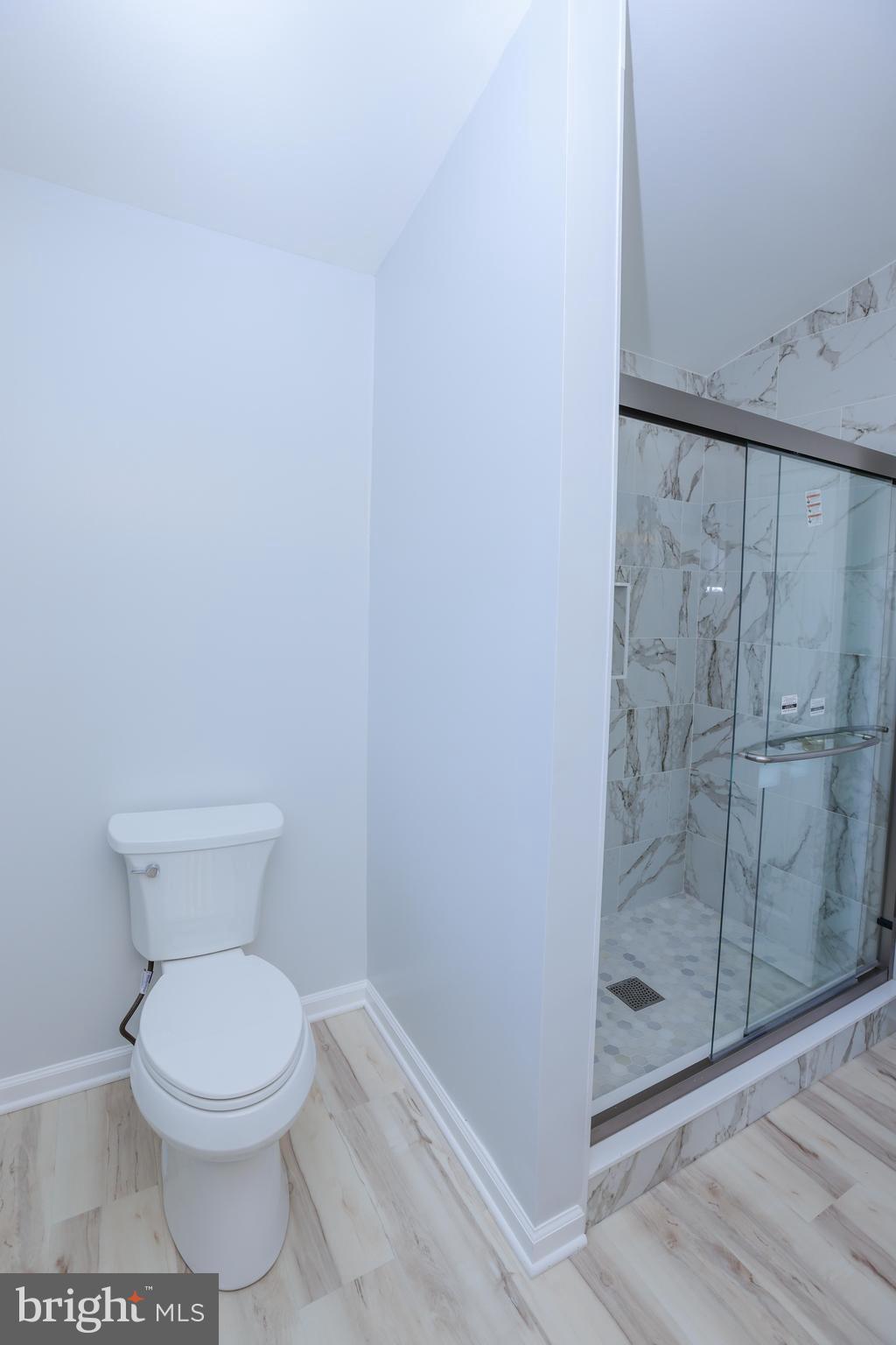 30 Queen Anne Road Glen Burnie, MD 21060 - Photo 18 of 47 a bathroom with a toilet and a shower