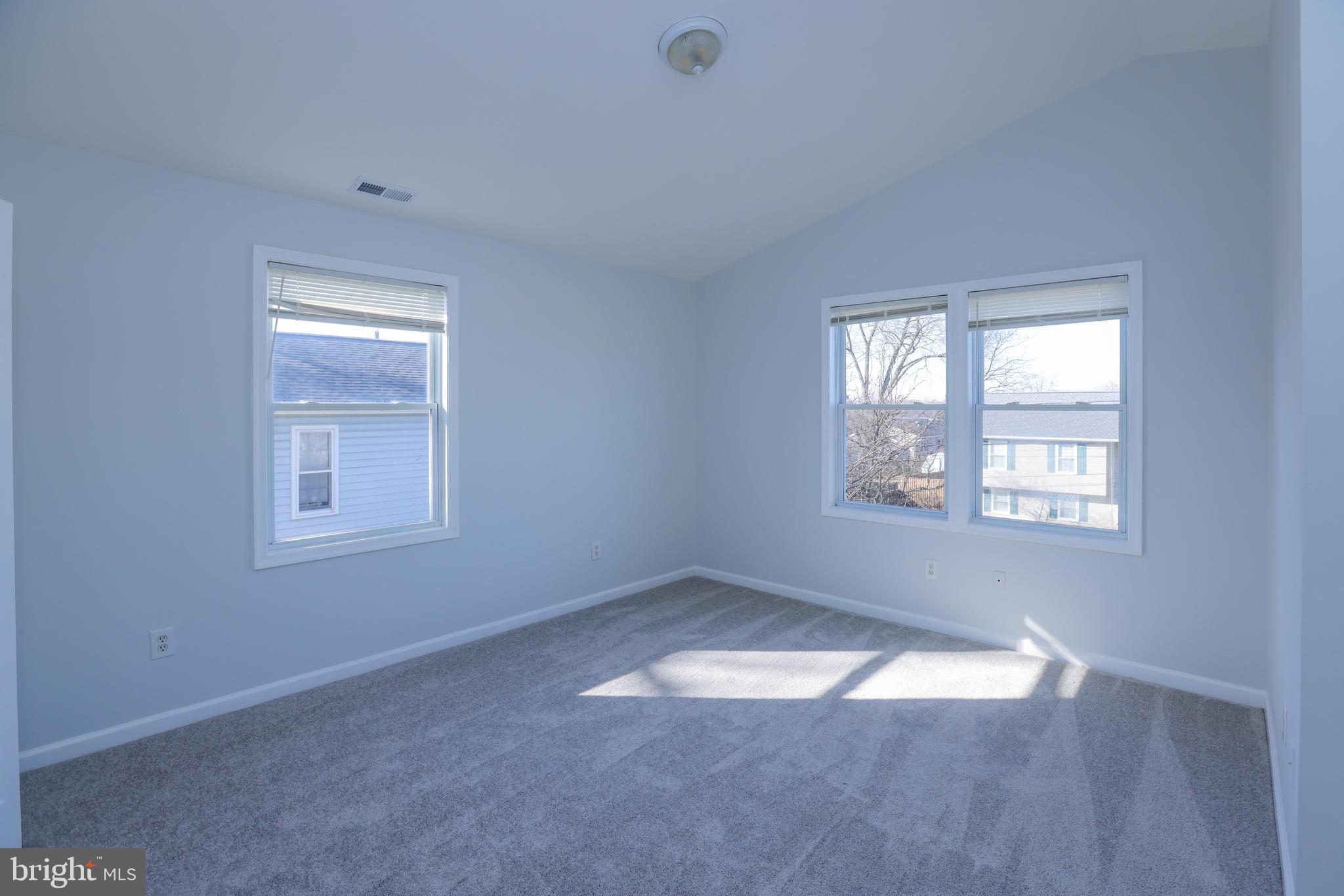30 Queen Anne Road Glen Burnie, MD 21060 - Photo 23 of 47 an empty room with a empty space and windows