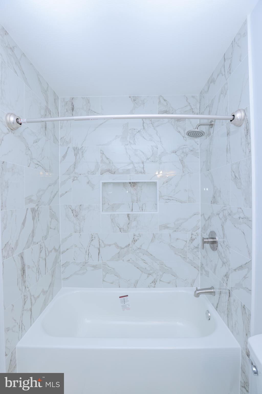 30 Queen Anne Road Glen Burnie, MD 21060 - Photo 32 of 47 a bathroom with a bathtub